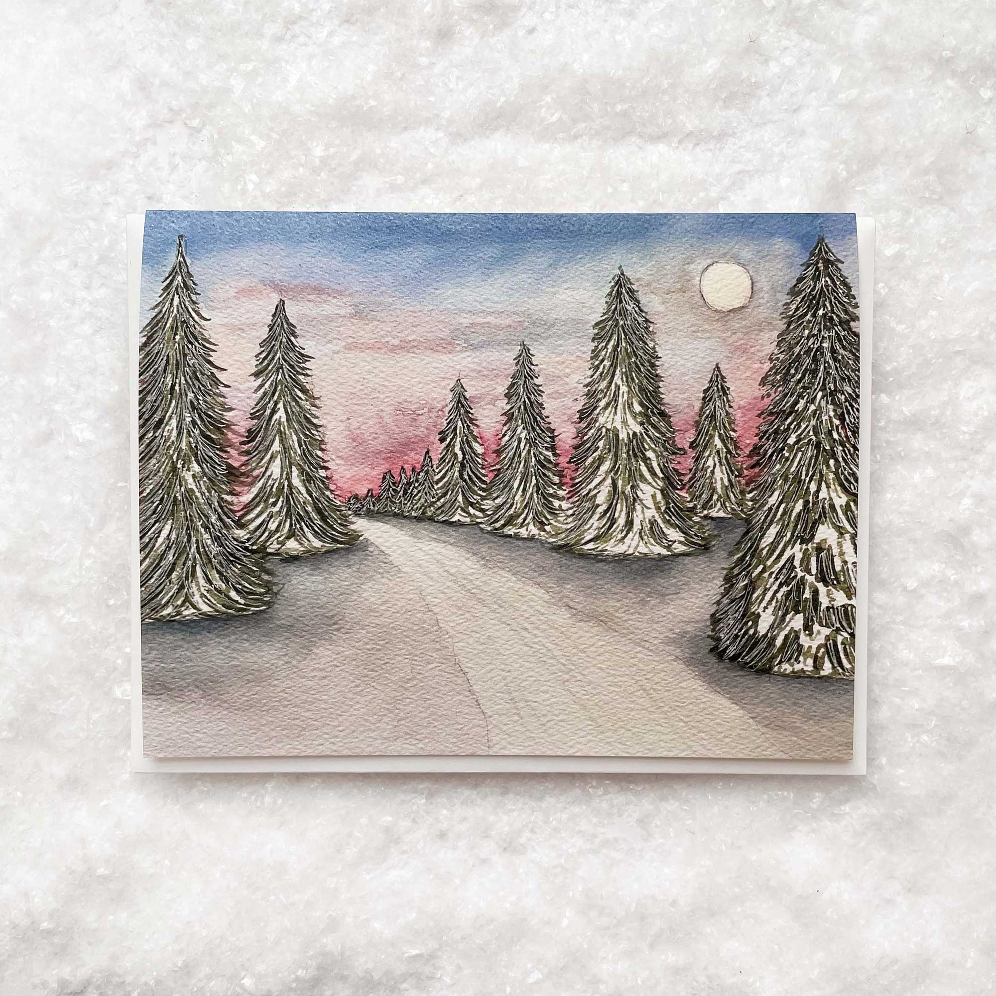 Christmas cards featuring a watercolor of a snow scene.
